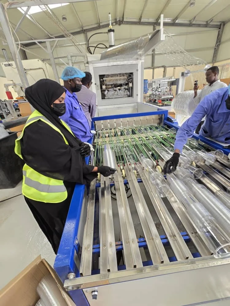 Plastic drinking cups on the WEEL Factory production line in Garowe